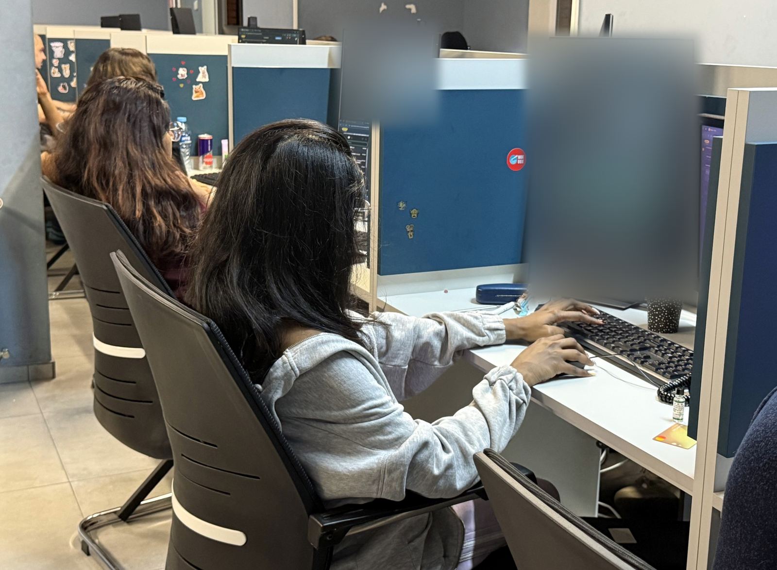 Two DSPro agents working side by side at their desks